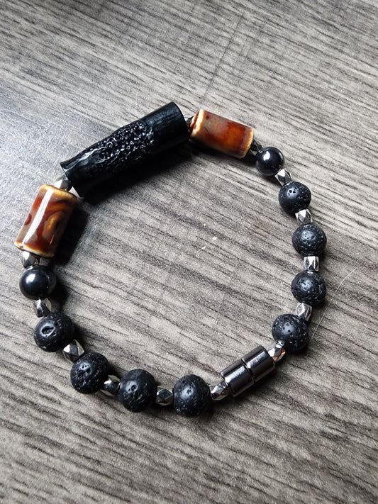 8" Hematite and black lava stone bracelet with brown glass bead and silver accents